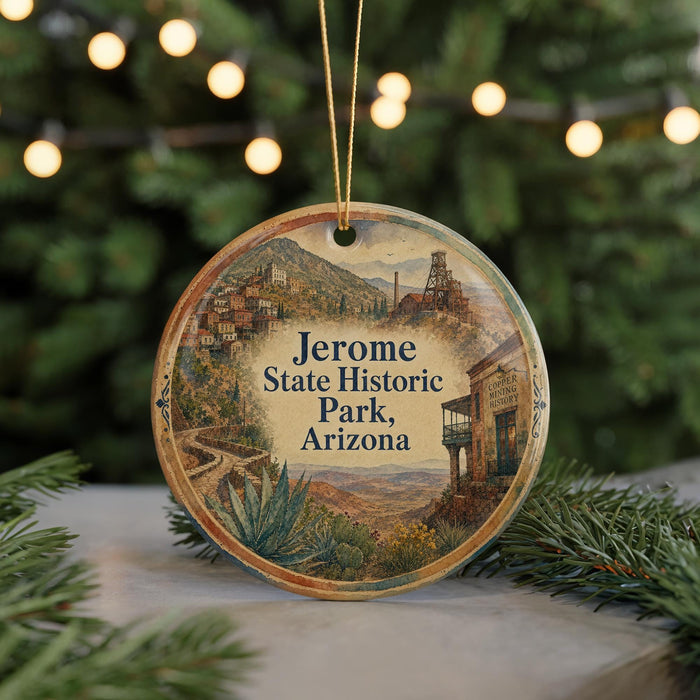 A circular ornament with a scenic image of Jerome State Historic Park, Arizona, hanging from a string.