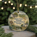 A round ornament with a painting of a historical park and a sign that says " Jimmy Carter National Historical Park Georgia".