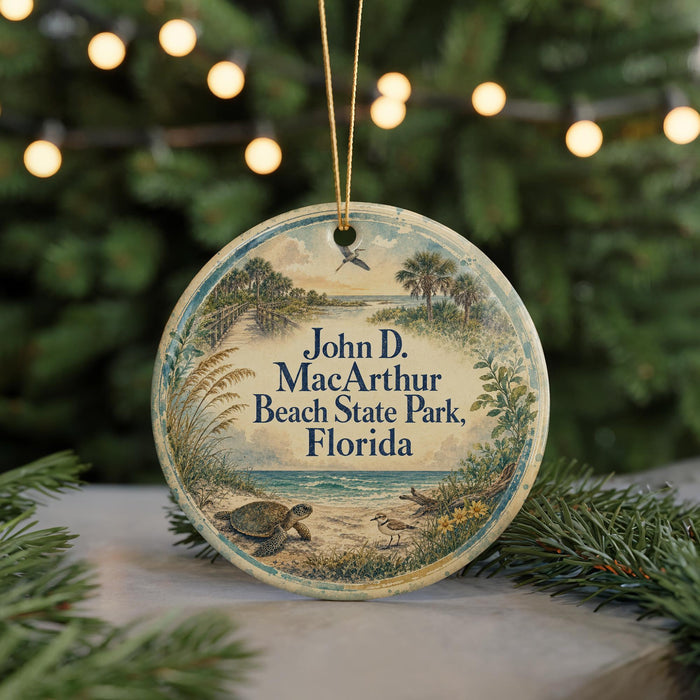 A round ornament with a beach scene and a bird, hanging on a string.