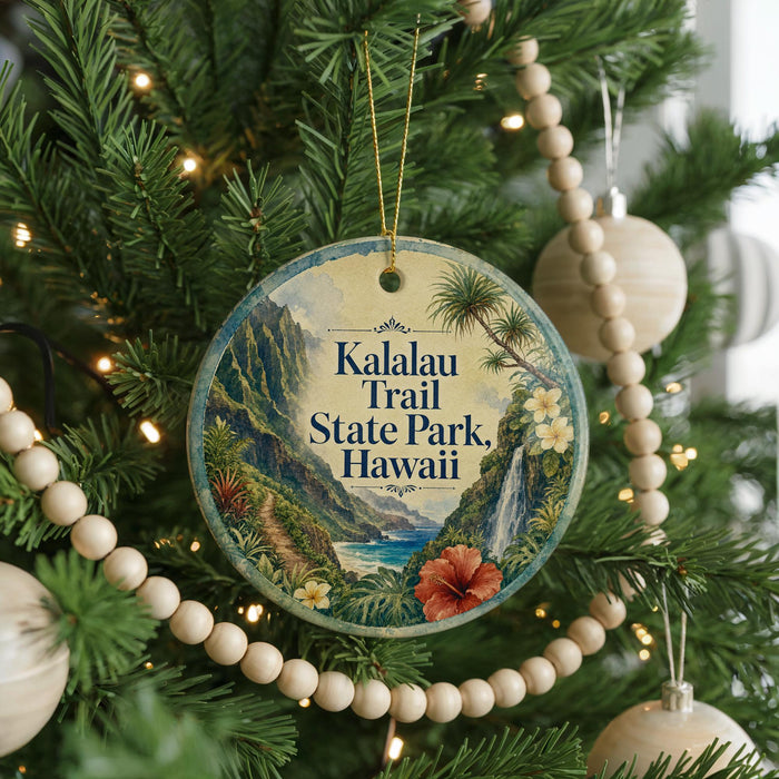 A circular ornament hanging on a Christmas tree, featuring a scenic image of the Kalalau Trail State Park in Hawaii.