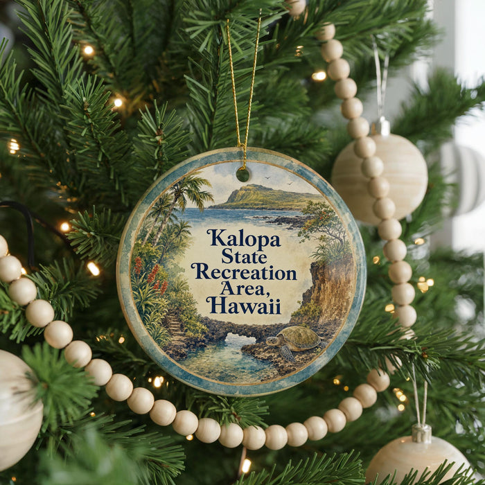 A circular ornament hanging on a Christmas tree, featuring a tropical landscape with palm trees and a body of water.
