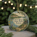 A circular ornament featuring a scenic image of Kaw River State Park, Kansas, with a bird, canoe, and other natural elements.