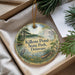 A decorative ornament with a scenic image of Killens Pond State Park, Delaware, hanging from a string.
