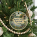 A round ornament on a Christmas tree, featuring a scenic image of Killens Pond State Park in Delaware.
