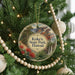 A round ornament hanging on a Christmas tree, featuring a scenic image of Koke'e State Park in Hawaii.