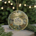 A circular ornament featuring a scenic image of Lake Bistaineau State Park in Louisiana, with a deer, a bird, and a boat in the water.