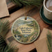 A decorative ornament featuring a scenic landscape of Lake Catherine State Park, Arkansas, with a waterfall and a cabin in the background.