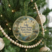 A round ornament hanging on a Christmas tree, featuring a scenic image of Lake Fausse Pointe State Park in Louisiana.