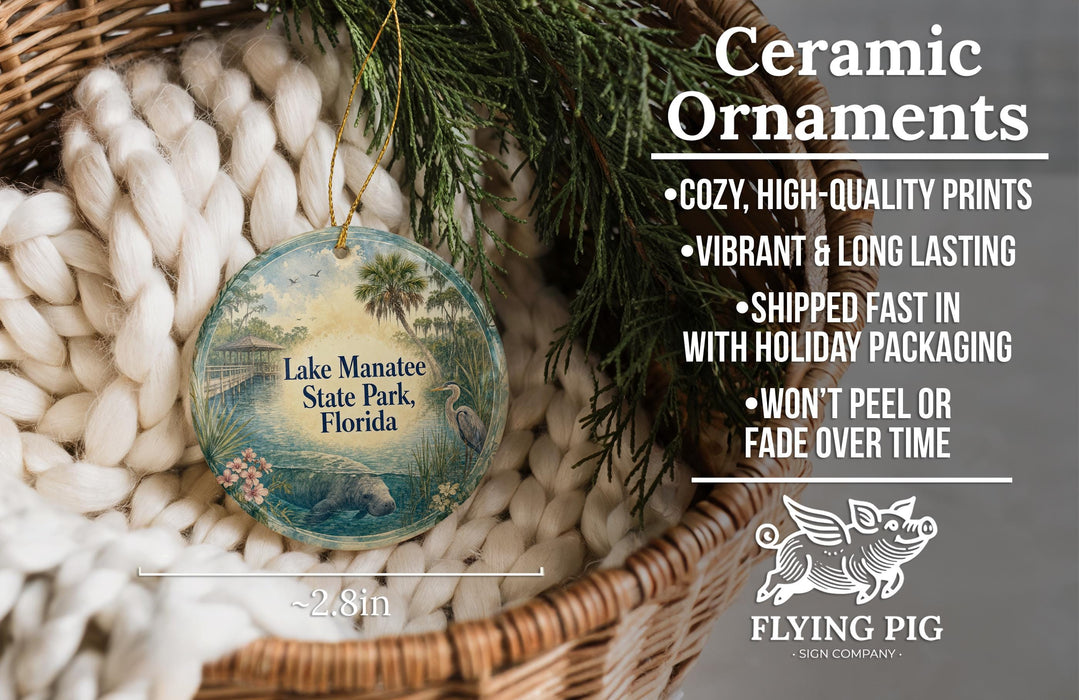 Ceramic ornaments, including a round ornament with a palm tree and a bird, are displayed in a basket.