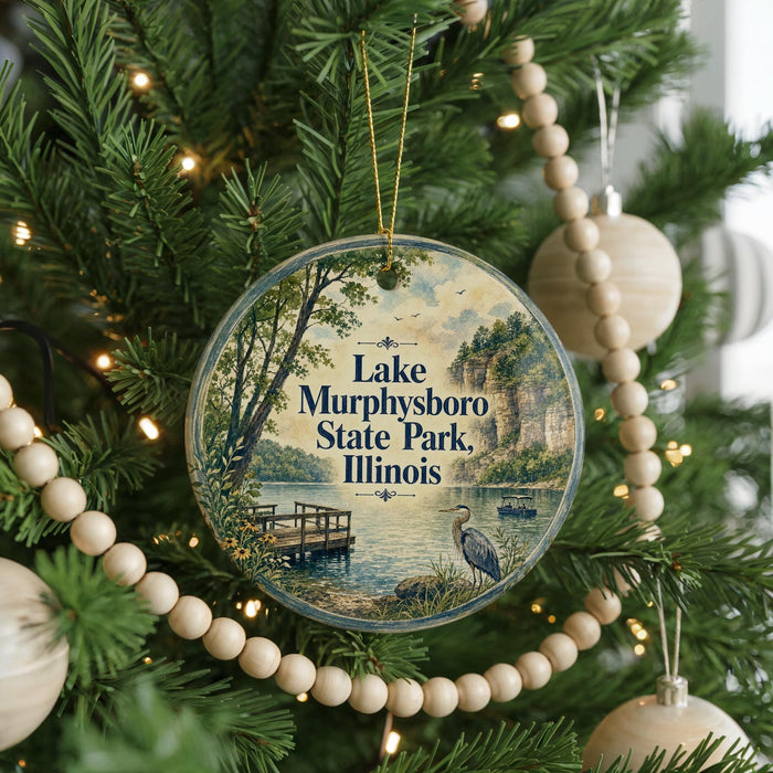 A circular ornament hanging on a Christmas tree, featuring a scenic image of Lake Murphysboro State Park, Illinois.