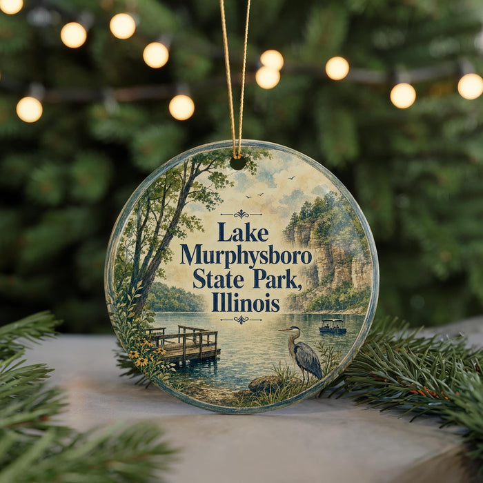 A circular ornament featuring a scenic image of Lake Murphysboro State Park in Illinois, with a bird and a dock in the foreground.