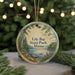 A round ornament with a scenic landscape of a lake, trees, and mountains, featuring the text "Lily Bay State Park, Maine".