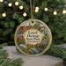 A round ornament with a painting of Lowell Heritage State Park in Massachusetts, featuring a river, buildings, and a bridge.