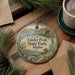 A round ornament with a scenic landscape of Lucky Peak State Park in Idaho, featuring pine trees, mountains, and a lake.