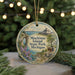 A decorative ornament featuring a scenic image of Mackinac Island, Michigan, with a bicycle, horse-drawn carriage, and a castle in the background.