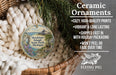 Ceramic ornaments, including a round ornament with a scenic image of Mackinac Island, Michigan, hanging from a wicker basket.
