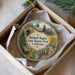 A round ornament with a painting of a historical site, specifically Malakoff Digins State Historic Park, California.