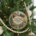 A round ornament hanging on a Christmas tree, featuring a scenic image of Malakoff Diggin's State Historic Park, California.