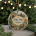 A round ornament with a scenic illustration of Malakoff Digins State Historic Park, California, featuring a train, a building, and a forest.