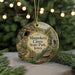 A circular ornament featuring an illustration of the Maquoketa Caves State Park in Iowa, with a string of lights in the background.