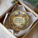 A decorative ornament in a box, featuring a desert landscape with a windmill, cactus, and other elements, along with the text "McFarland State Historic Park, Arizona".