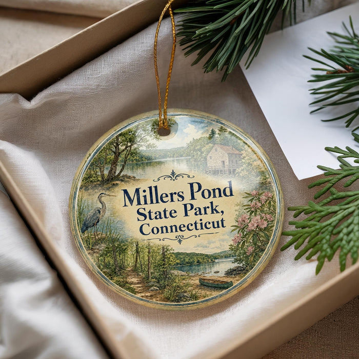 A round ornament with a scenic image of Millers Pond State Park, Connecticut, hanging from a string.