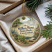 A round ornament with a scenic image of Millers Pond State Park, Connecticut, hanging from a string.