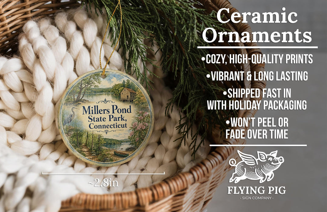 Ceramic ornaments, specifically a ceramic ornament with a design of Millers Pond State Park, Connecticut, hanging from a wicker basket.