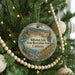 A round ornament hanging on a Christmas tree, featuring a scenic landscape of Millerton Lake and the State Recreation Area in California.