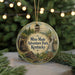 A round ornament with a picture of a mountain and a sign that says " Mine Made Adventure Park, Kentucky".