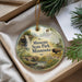 A decorative ornament with a scenic landscape of Minnesota State Park, featuring a waterfall, a bridge, and a bison in the foreground.