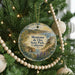 A round ornament hanging on a Christmas tree, featuring a scenic landscape of Montana State Park, California.