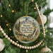 A round ornament hanging on a Christmas tree, featuring a scenic image of Mount San Jacinto State Park, California.