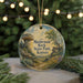 A round ornament with a painting of a mushroom rock and a path leading to Mushroom Rock State Park in Kansas, surrounded by greenery and a string of lights.