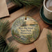 A decorative ornament with a scenic landscape of Myre-Big Island State Park, Minnesota, featuring pine trees, a lake, and a sunset.