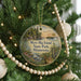 A circular ornament hanging on a Christmas tree, featuring a scenic landscape of Myre-Big Island State Park, Minnesota.