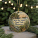 A circular ornament with a scenic landscape of Myre-Big Island, Minnesota, featuring a lake, pine trees, and a sunset.