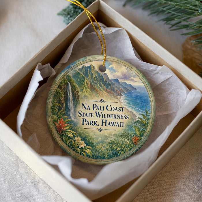 A decorative ornament in a box, featuring a scenic image of the Na Pali Coast State Wilderness Park in Hawaii.