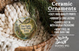Ceramic ornaments, including a round ornament with a scenic image of Nine Eagles State Park, Iowa, hanging from a wicker basket.