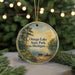 A circular ornament with a painting of a lake and trees, featuring the text "Osego Lake State Park, Michigan" on it.