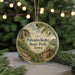 A circular ornament with a scenic landscape of Palisades-Kepler State Park, Iowa, featuring a path leading to a cabin surrounded by trees and mountains.