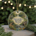 A circular ornament with a painting of Patuxent River State Park, Maryland, featuring a bird, a bridge, and a waterfall.