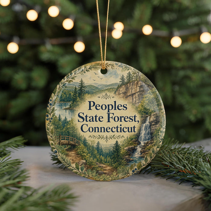 A decorative ornament with a scenic forest landscape and a waterfall, featuring the text "Peoples State Forest, Connecticut" on it.