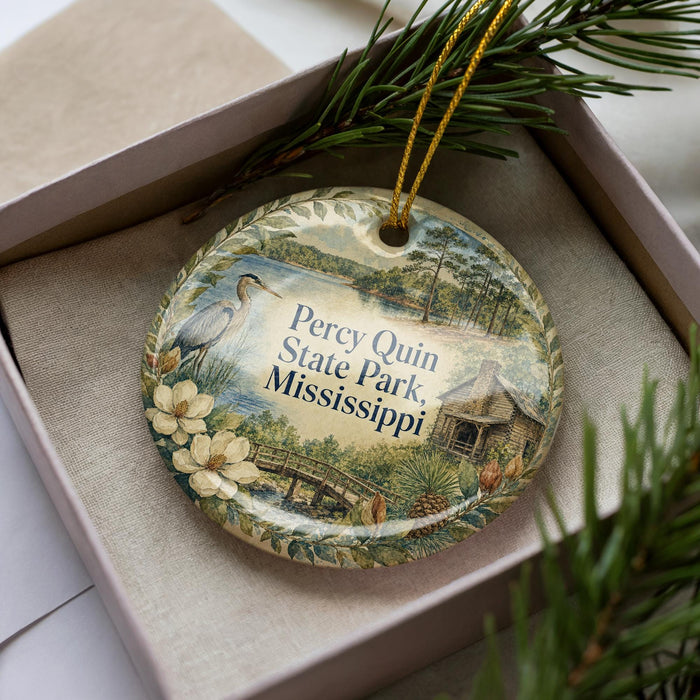 A decorative ornament in a box, featuring a scenic image of Perry Quin State Park in Mississippi.