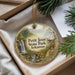 A decorative ornament with a scenic landscape of Petit Jean State Park, Arkansas, hanging from a string.