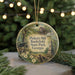 A round ornament with a picture of a historic site, specifically Pickett's Mill Battlefield State Park, Georgia, surrounded by greenery and twinkling lights.
