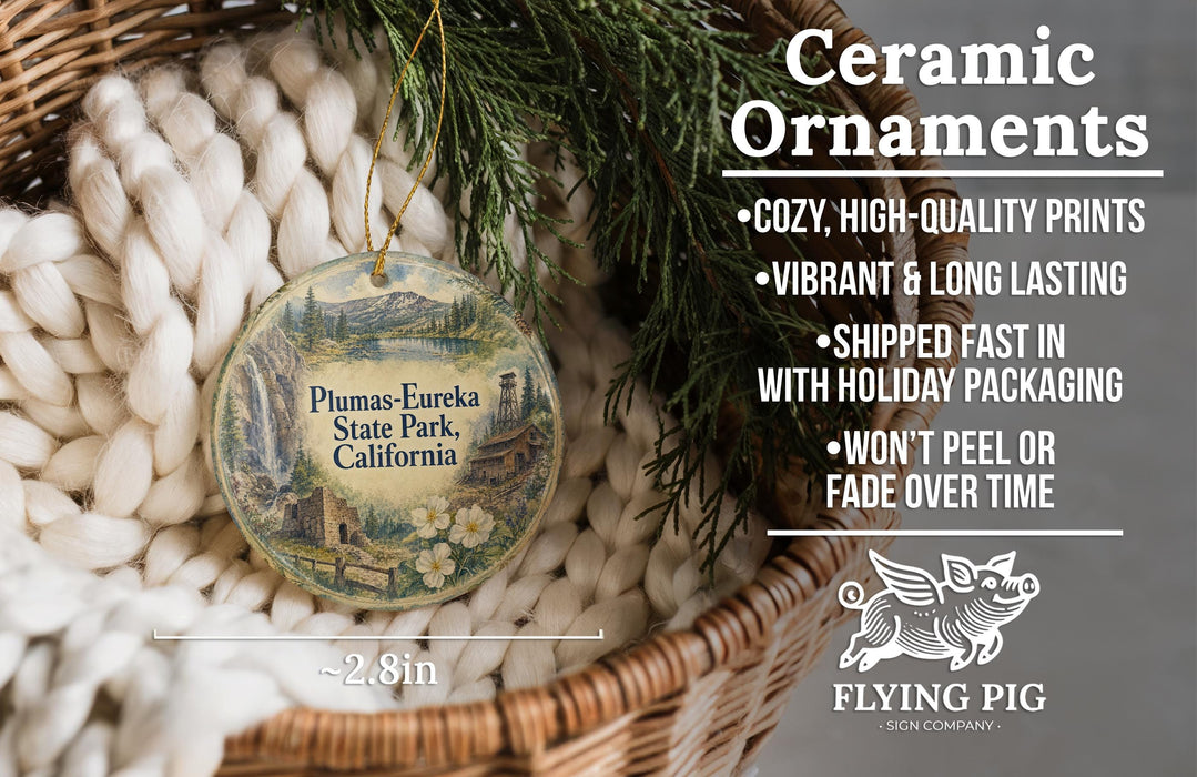 Ceramic ornaments, featuring a detailed illustration of Plumas-Eureka State Park, California, hanging from a wicker basket.