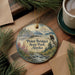A round ornament with a scenic landscape of Point Bridget State Park, Alaska, featuring a mountain range, a river, and a bird of prey.