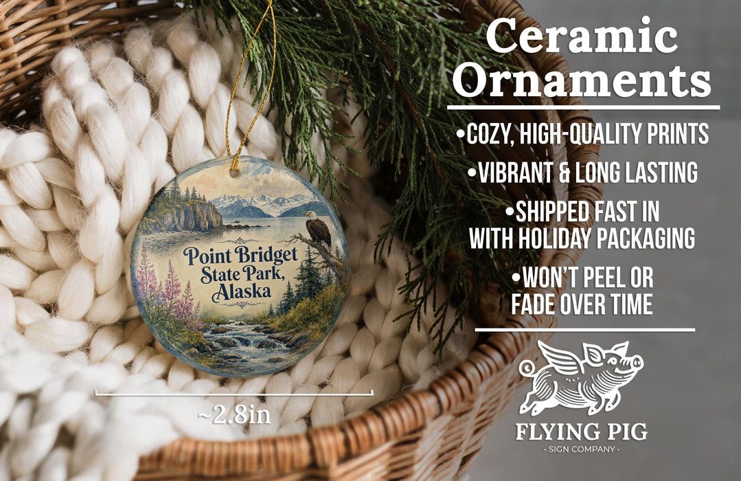 Ceramic ornaments, featuring a scenic image of Point Bridge State Park, Alaska, hanging from a wicker basket.