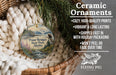 Ceramic ornaments, featuring a scenic image of Point Bridge State Park, Alaska, hanging from a wicker basket.